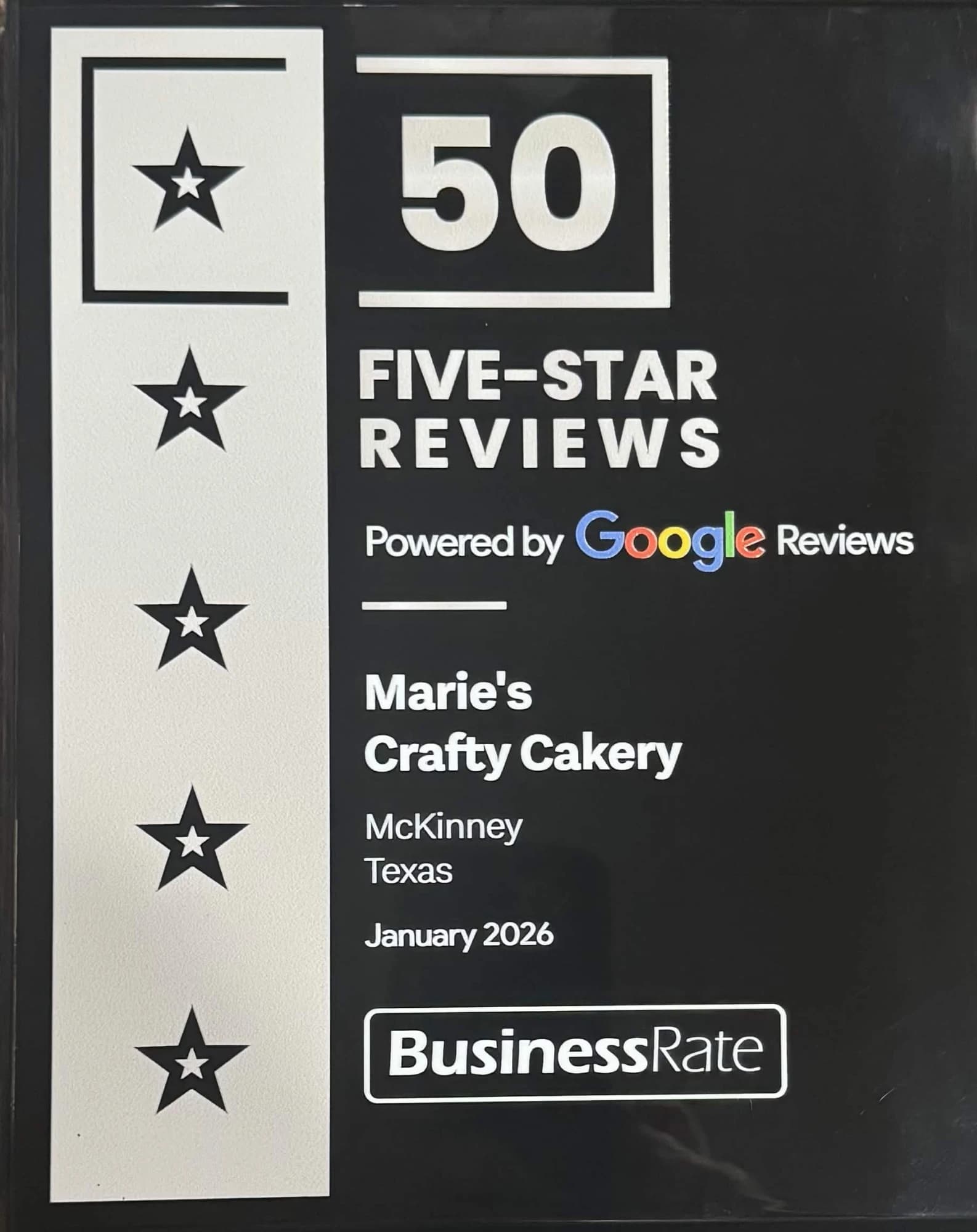 BusinessRate plaque recognizing Marie's Crafty Cakery for 50 five-star Google reviews, January 2026
